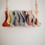 Silikonové bryndáčky MUSHIE | Stylové doplňky pro děti a ženy | Lavly.cz